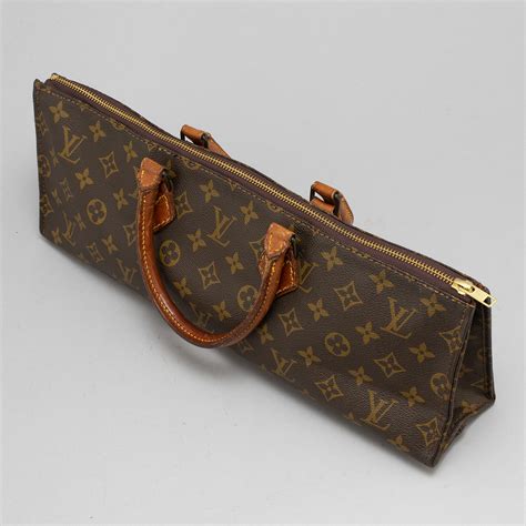 louis vuitton triangle crossbody|Louis Vuitton logo.